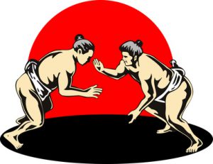 Sumo wrestlers fighting