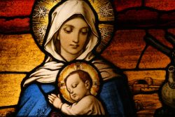 Stained glass depicting the Virgin Mary holding baby Jesus