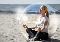 Woman Meditating on Beach in Peace