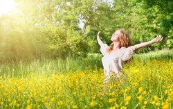 beautiful girl enjoying the summer sun outdoors in the park